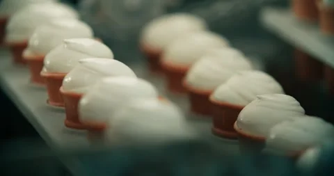 Production of creamy ice cream in a waffle cup. Sweet treat. Stock Footage 256132425