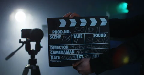 Production crew cueing the team to start camera roll Stock Footage 102846738