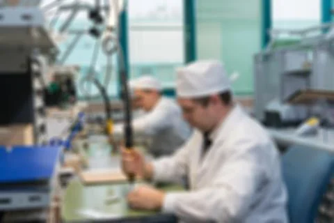 Production of electronic components  at high-tech factory blur b Stock Photos