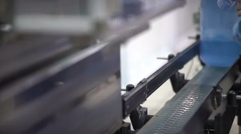 Production employee pulls on the neck of the bottle branded check Stock Footage 68639941