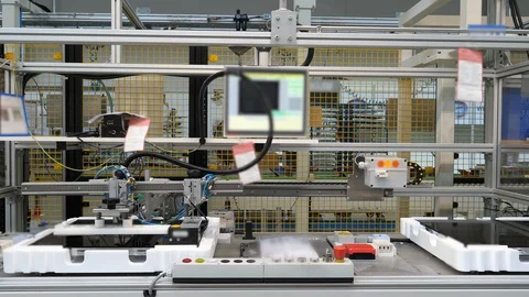 Production of induction hobs, robot tests the product Stock Footage 94626686