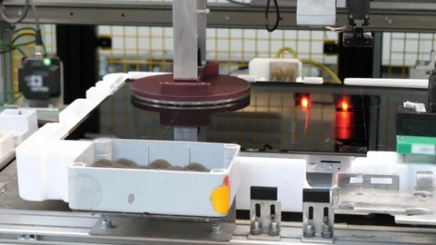 Production of induction hobs, robot tests the product, close up Vídeos de archivo 94714400