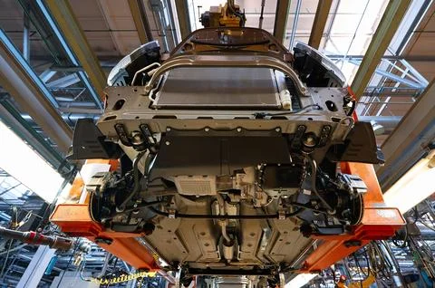 Production line assembles modern passenger car at plant Stock Photos