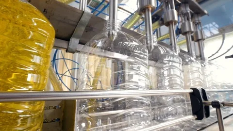 Production line of bottles being filled with liquid. Stock Footage