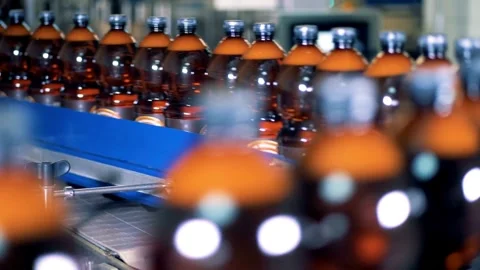 Production Line of Carbonated Drinks Close up of plastic bottle industry on a Stock-Footage 334587383