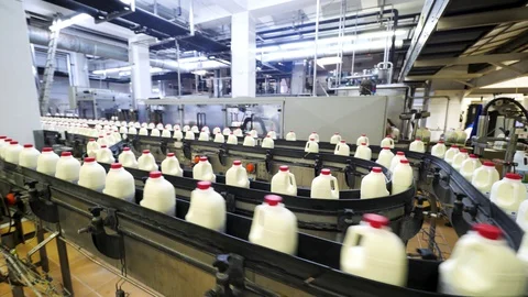 Production line at dairy factory for milk in plastic bottles Stock Footage