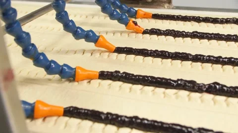 On The Production Line, The Filling Is Automatically Applied To The Dough. Baker Stock Footage 174727087