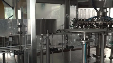 Production line of plastic bottles. Plastic bottles on the automatic conveyor Stock Footage 111663346