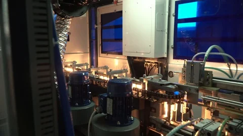 Production line of plastic bottles. Plastic bottles on an automatic conveyor Stock Footage 111663444