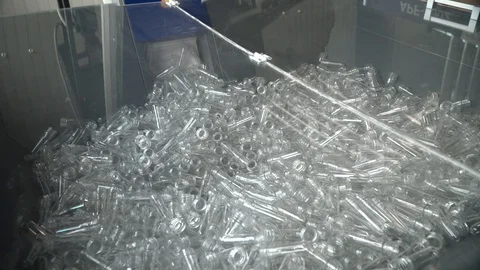 Production line of plastic bottles.box with blanks in the form of flasks Stock Footage 111662460