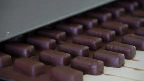 Production line for the production of chocolates. Candy covered with chocolate Video stock 74145411