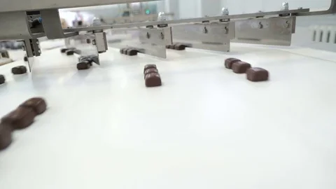 Production line for the production of chocolates. Candy covered with chocolate Video stock 74145429
