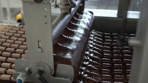 Production line for the production of chocolates. Candy covered with chocolate Video stock 74145442