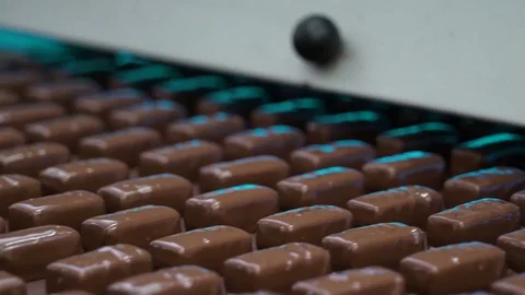 Production line for the production of chocolates. Candy covered with chocolate Video stock 74145455