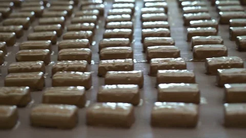 Production line for the production of chocolates. Candy covered with chocolate Video stock 74183028