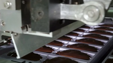 Production line for the production of chocolates. Candy covered with chocolate Stock Footage 74183285