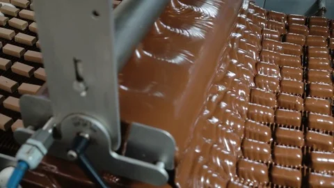 Production line for the production of chocolates. Candy covered with chocolate Video stock 74205199