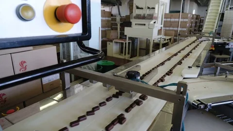 Production line for the production of chocolates. Candy covered with chocolate Video stock 74206589