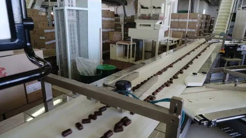 Production line for the production of chocolates. Candy covered with chocolate Video stock 74206804
