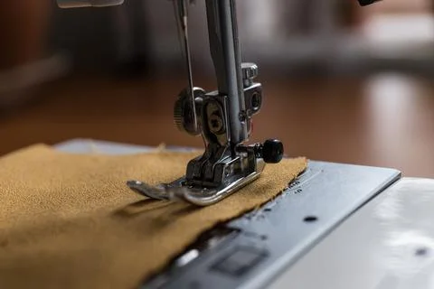 Production line sewing machine. Needle and footstep detail Stock Photos