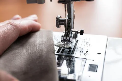 Production line sewing machine. Needle and footstep detail Stock Photos