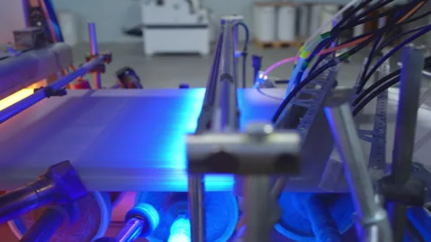 Production line uses turning rollers to apply foil to windowsills Stock Footage 304429064