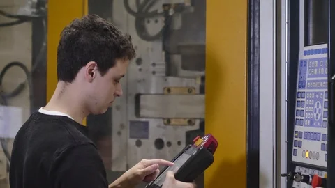 Production, Machine Adjuster Adjusts the Automatic Injection Molding Machine 動画素材 127031128