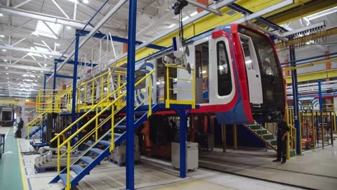 Production of metro wagons. view of subway car manufacturing workshop. working Stock Footage 202049163