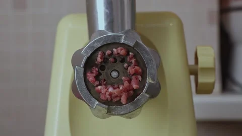 Production of minced chicken. Electric meat grinder makes minced meat Stock Footage 230094898