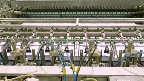 Production of office paper. The machine cuts paper into A4 sheets Stock Footage 315648396