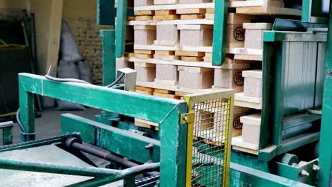 Production of pallets. The industrial line stacks pallets one on top of the Stock Footage 201091176