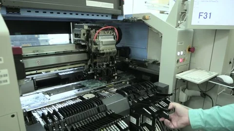 Production of PCB by machine. Setting up the production of PCB. Stock Footage 81005597