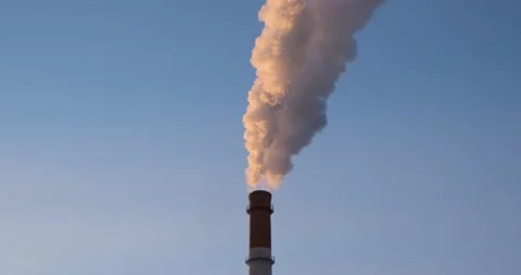Production pipe with white smoke on a blue sky background. Smoking chimney. Video stock 166299052