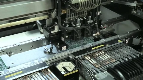 Production Of Printed Circuit Boards by machine. Component installation Stock Footage 81004402