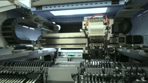 Production Of Printed Circuit Boards by machine. Component installation Stock Footage 81005261