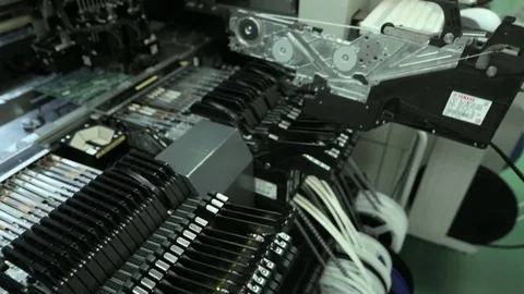 Production Of Printed Circuit Boards by machine. Component installation Stock Footage 81005326