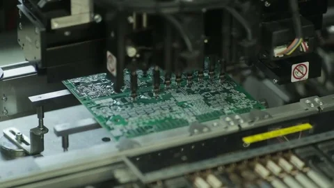 Production Of Printed Circuit Boards by machine. Component installation. PCB. Stock Footage 81005596