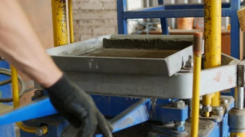 Production process of concrete road surface in the form of brick. Seals sand Stock Footage 95390809