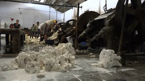 Production process in dimly lit rubber factory Indonesia Asia Stock Footage 78429607