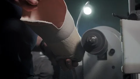 Production of a prosthetic leg. A man creates a part of the leg above the knee Stock Footage 120141168