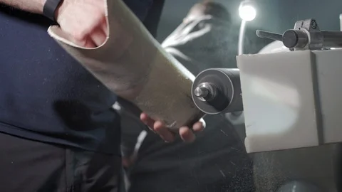 Production of a prosthetic leg. A man creates a part of the leg above the knee Stock Footage 120142453