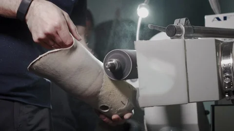 Production of a prosthetic leg. A man creates a part of the leg above the knee Stock Footage 120143382
