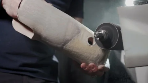 Production of a prosthetic leg. A man creates a part of the leg above the knee Stock Footage 120144870