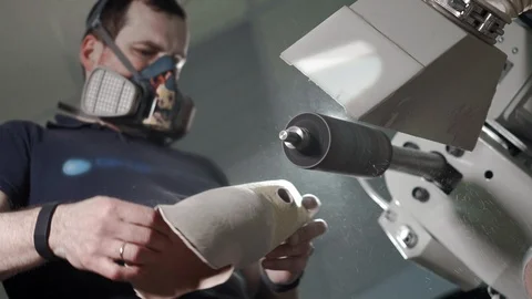 Production of a prosthetic leg. A man creates a part of the leg above the knee 스톡 동영상 120151340