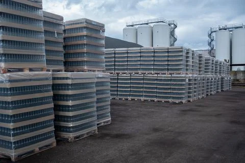 Production racks of packaging for empty beer bottles at a brewery. Stock Photos