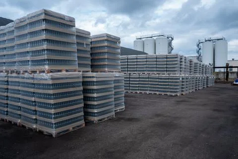 Production racks of packaging for empty beer bottles at a brewery. Stock Photos