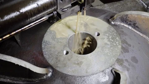 In the production room in a metal structure, the machine makes a slot. Stock Footage 116649982