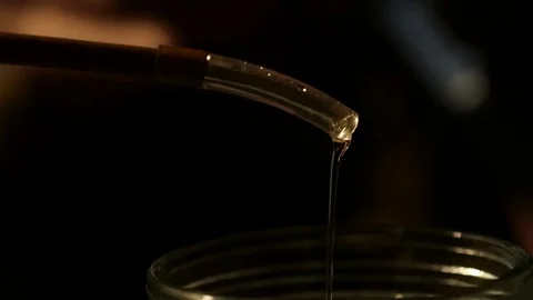 Production of strong drinks, drops of alcohol drip into a glass Video stock 85379750