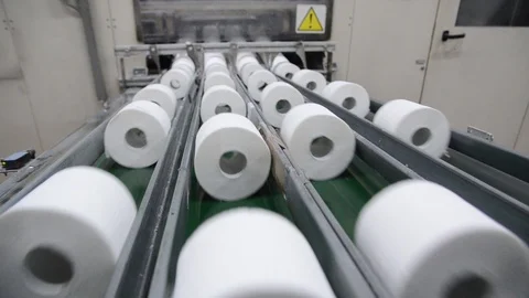 Production of Toilet paper in factory. Toilet paper rolls making machine. Tissue Stock Footage