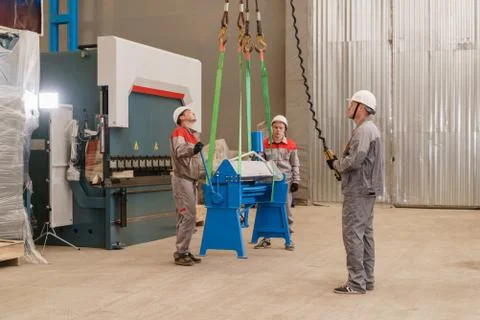 Production of ventilation and drainpipe. Workers adjusts the machine in the Stock Photos